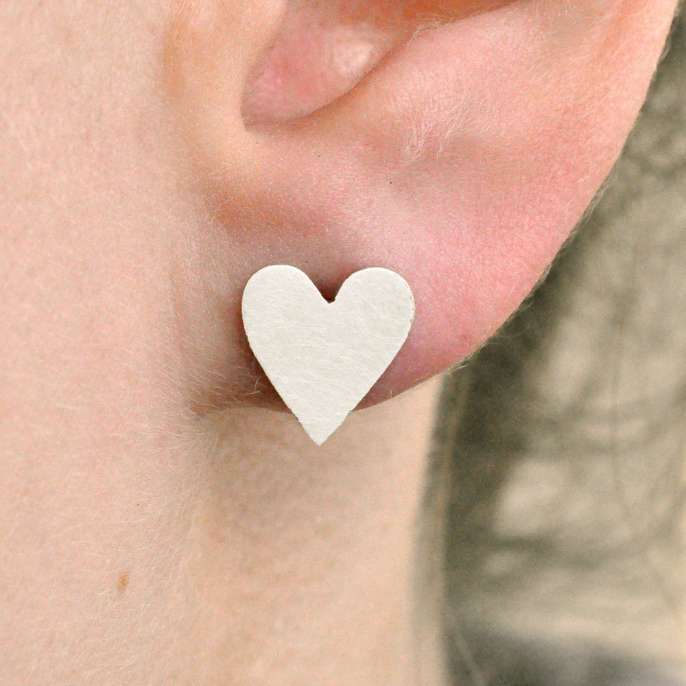 Sterling silver heart earrings. Handmade by EC Design in Minneapolis, MN with recycled metals.