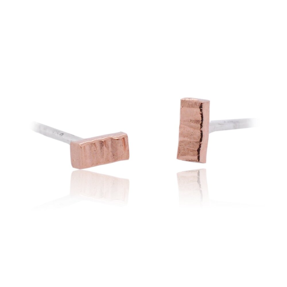 Linear hammered red gold bar studs. Handmade by EC Design Jewelry in Minneapolis, MN.