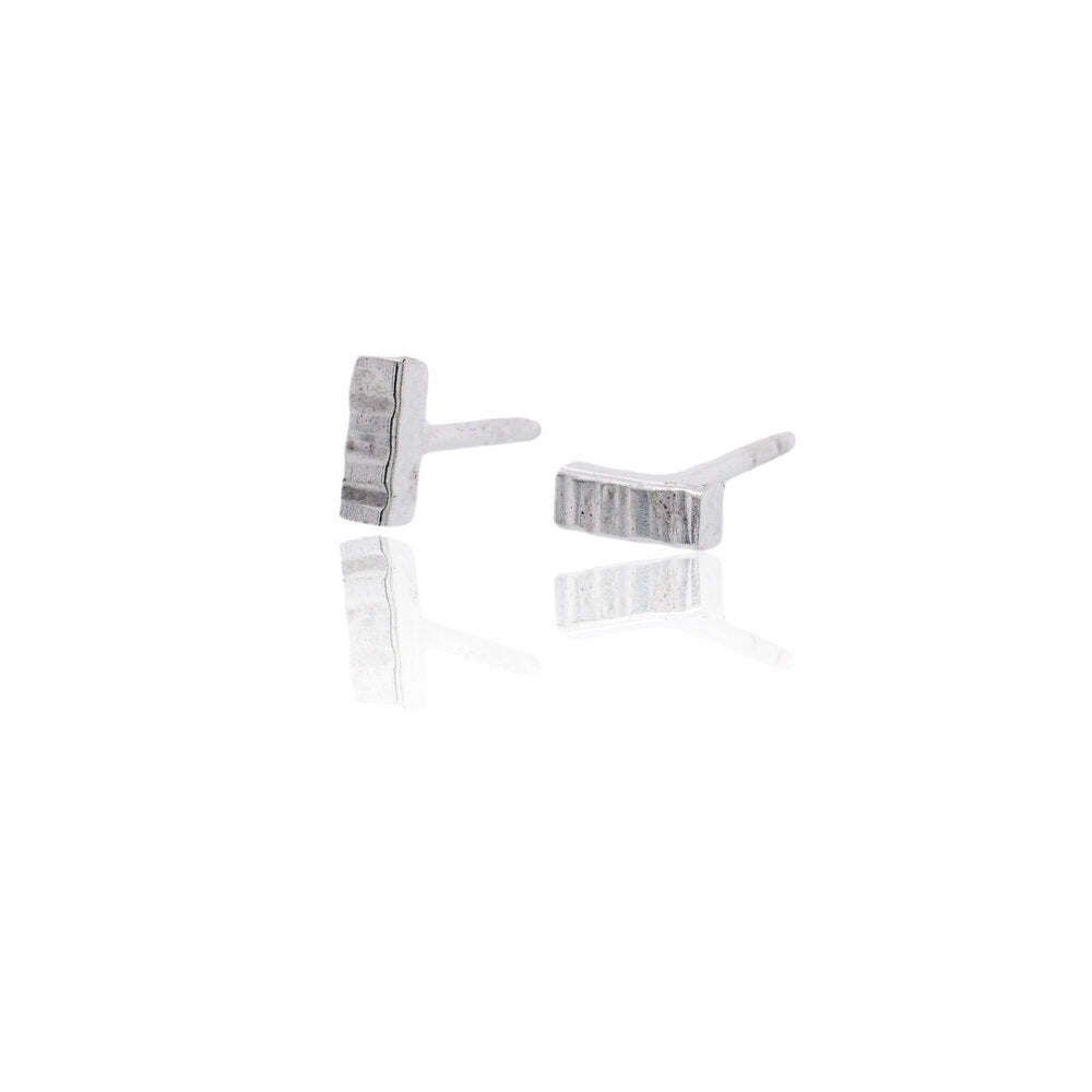 Sterling silver bar studs from EC Design Jewelry. Handmade in linear or round hammered finishes.