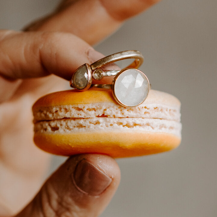 Handmade sapphire and diamond rings on a macaroon. Rings are handmade by EC Design Jewelry in Minneapolis, MN.