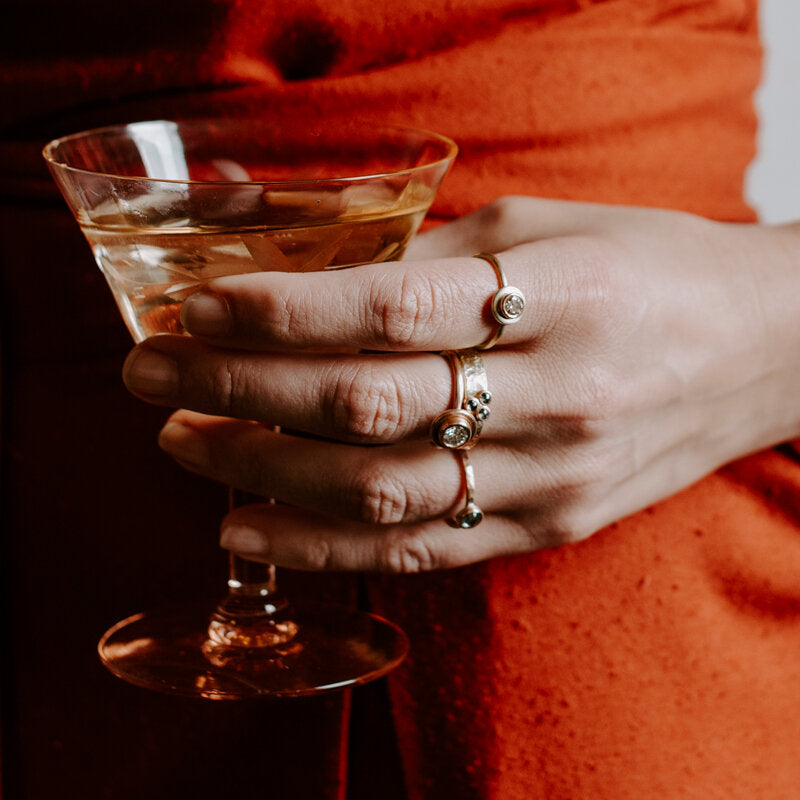 Handmade diamond rings in mixed metal. Created by EC Design in Minneapolis, MN using recycled metal and conflict-free stones.