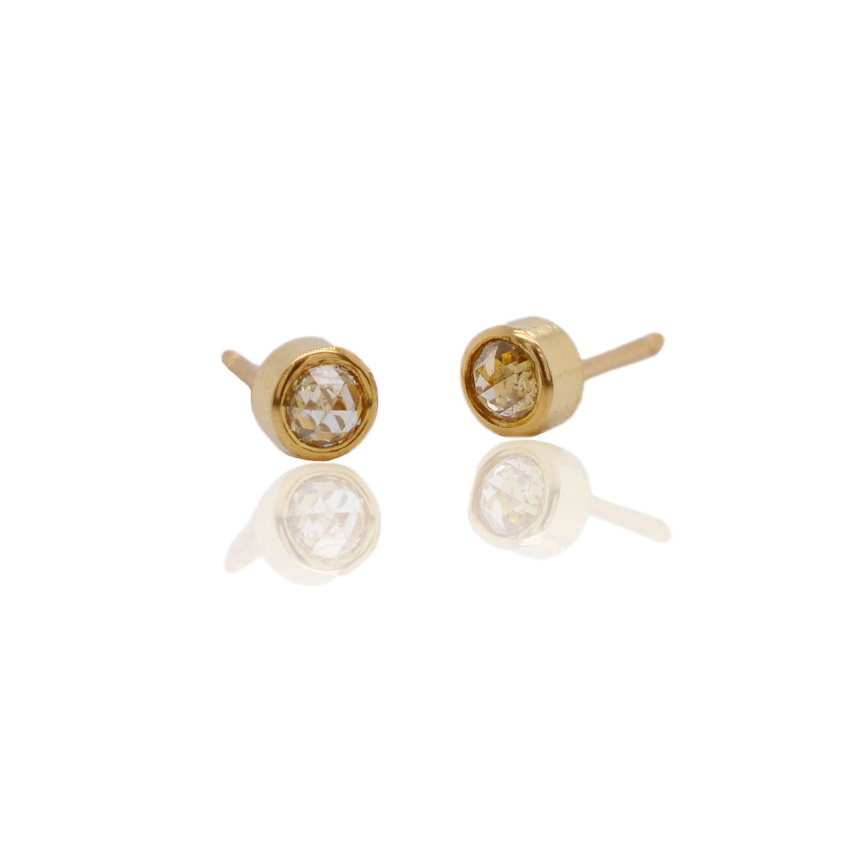 Yellow diamond studs in yellow gold. Handmade by EC Design Jewelry in Minneapolis, MN.