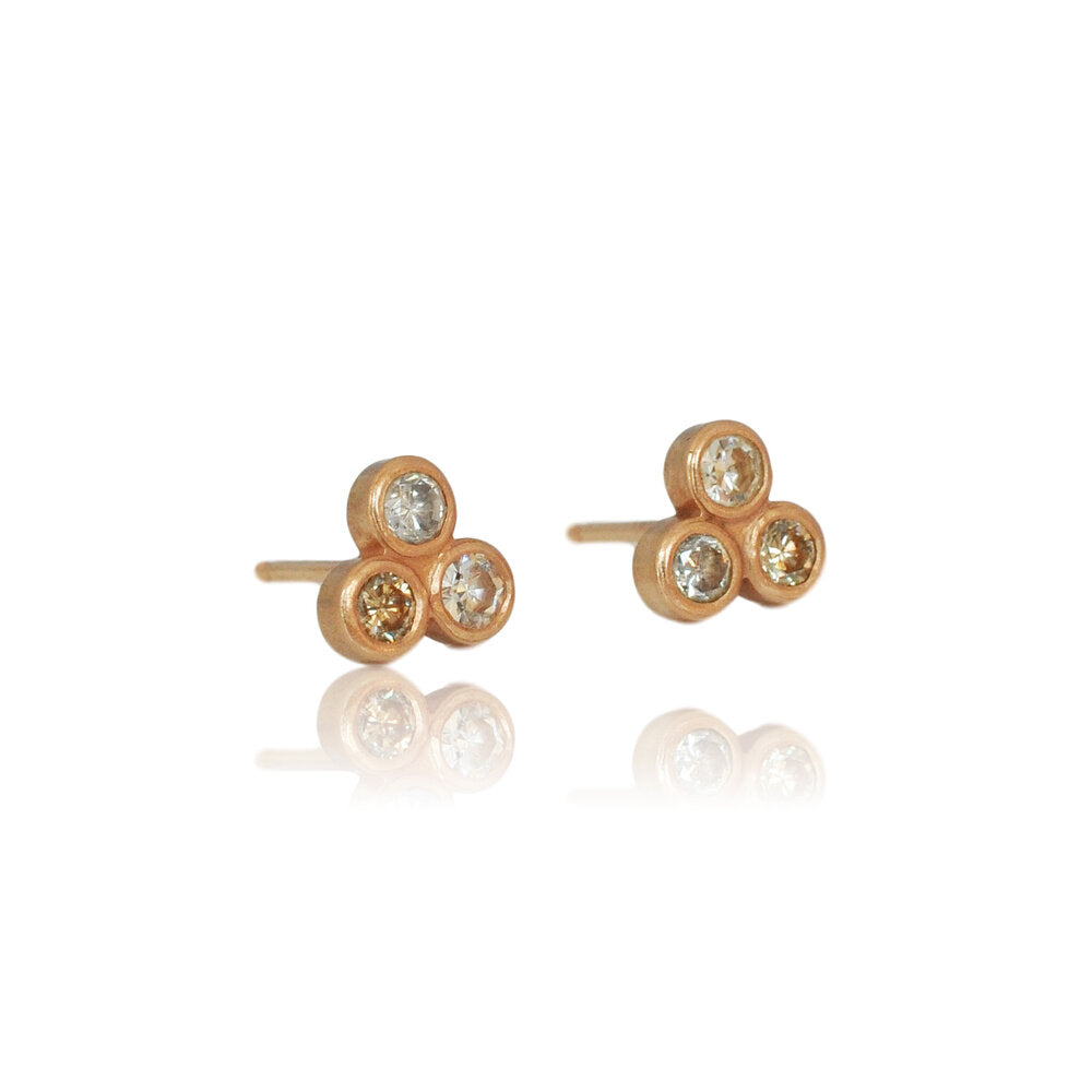 Mixed diamond 3 stone stud earrings in rose gold. Handmade by EC Design Jewelry in Minneapolis, MN.