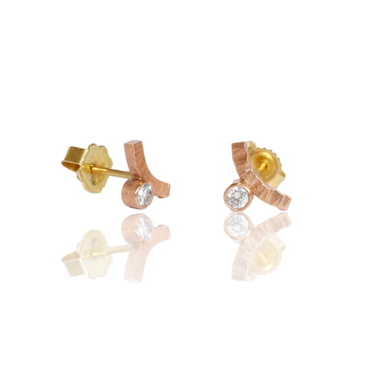 Rose gold diamond earrings with yellow gold posts and backs. Handmade with recycled metal and conflict-free stones.
