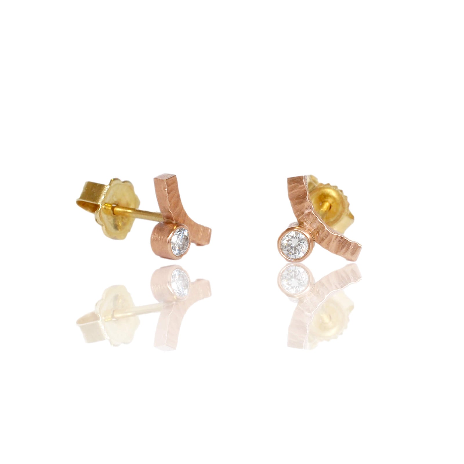 Rose gold diamond earrings with yellow gold posts and backs. Handmade with recycled metal and conflict-free stones.