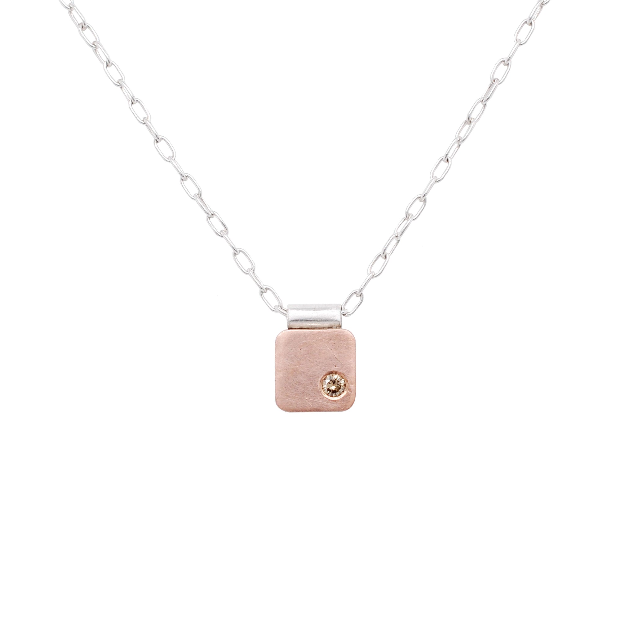 Rose gold cell pendant with champagne diamond accent. Handmade by EC Design Jewelry in Minneapolis, MN.