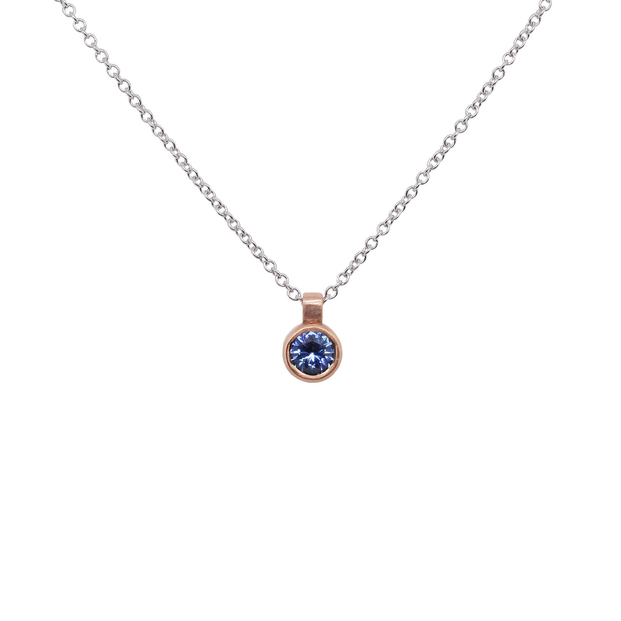 Ceylon blue sapphire and rose gold pendant. Handmade by EC Design Jewelry in Minneapolis, MN using recycled metal and conflict-free stone.