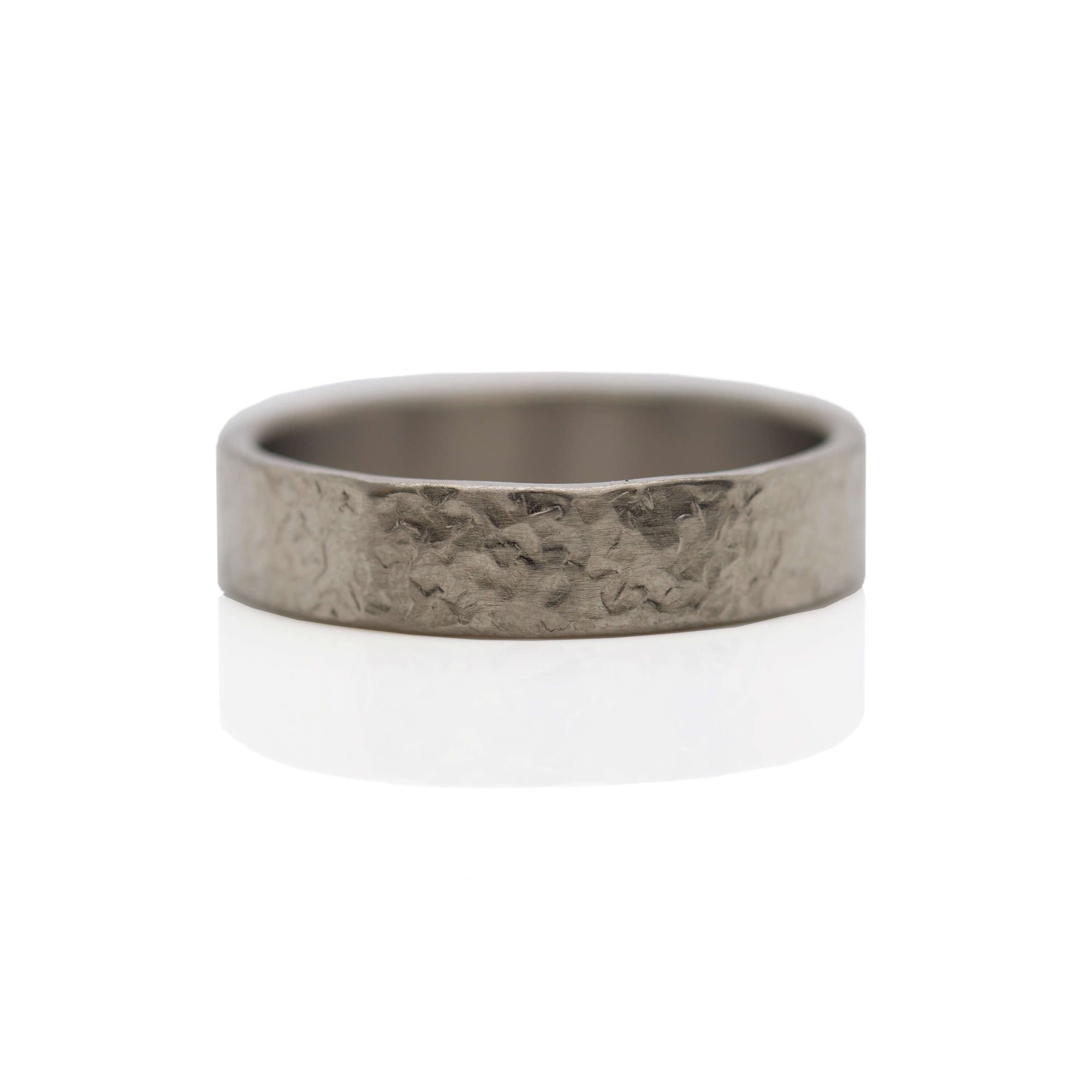 Silk hammered palladium wedding band made with recycled metal. EC Design Jewelry in Minneapolis, MN.