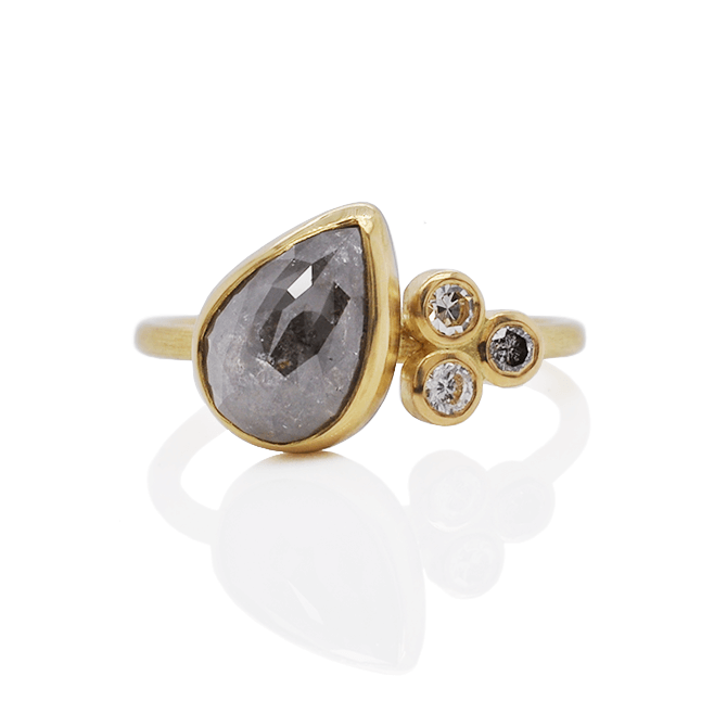 Gray teardrop cluster ring in yellow gold with mixed diamond accents.