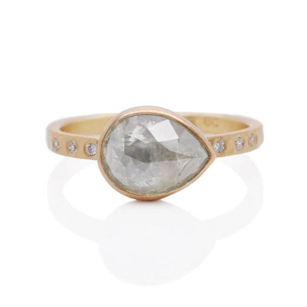 Rose cut ice diamond engagement ring on a hand hammered band of 14k yellow gold with diamond accents.