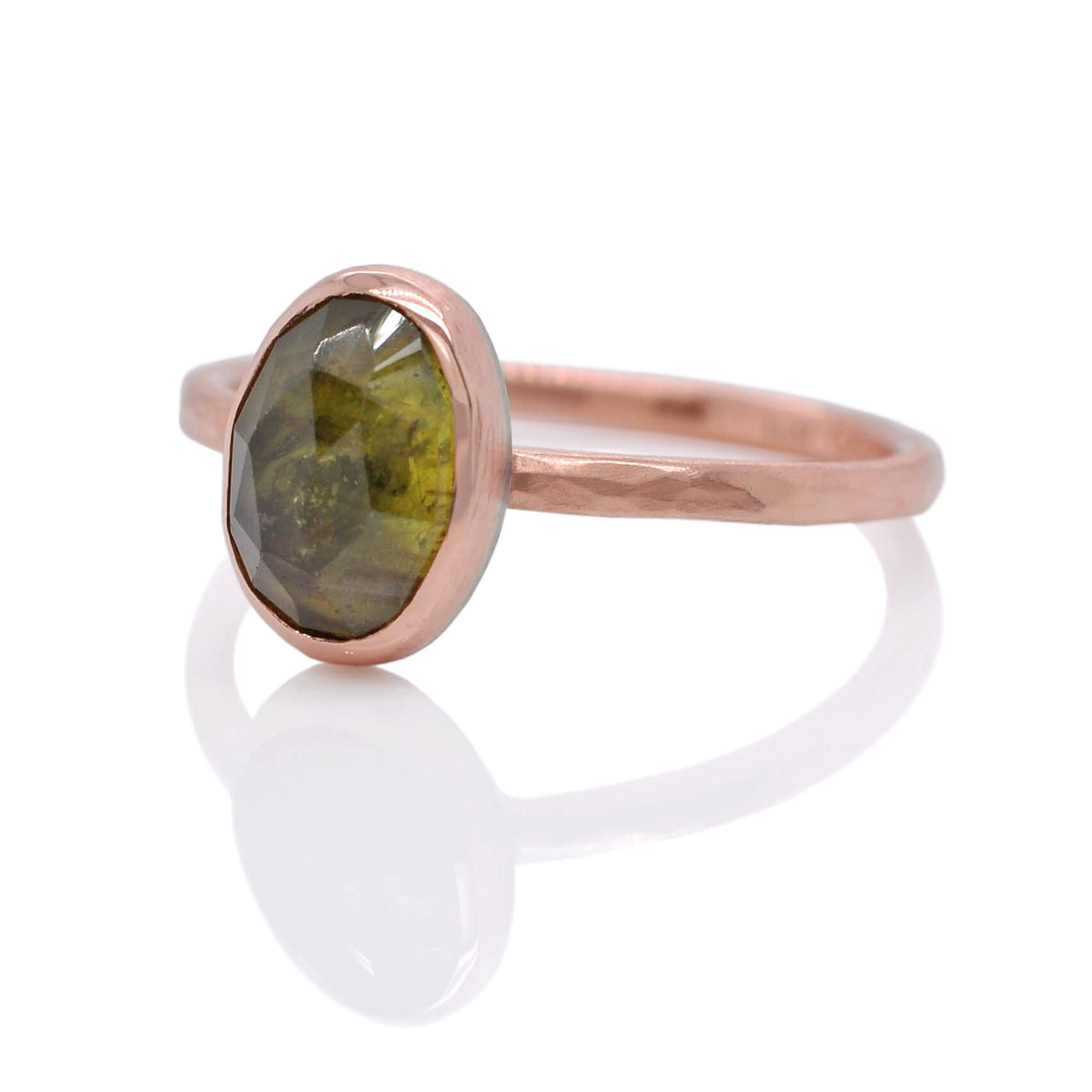Green sapphire ring in hand hammered rose gold.