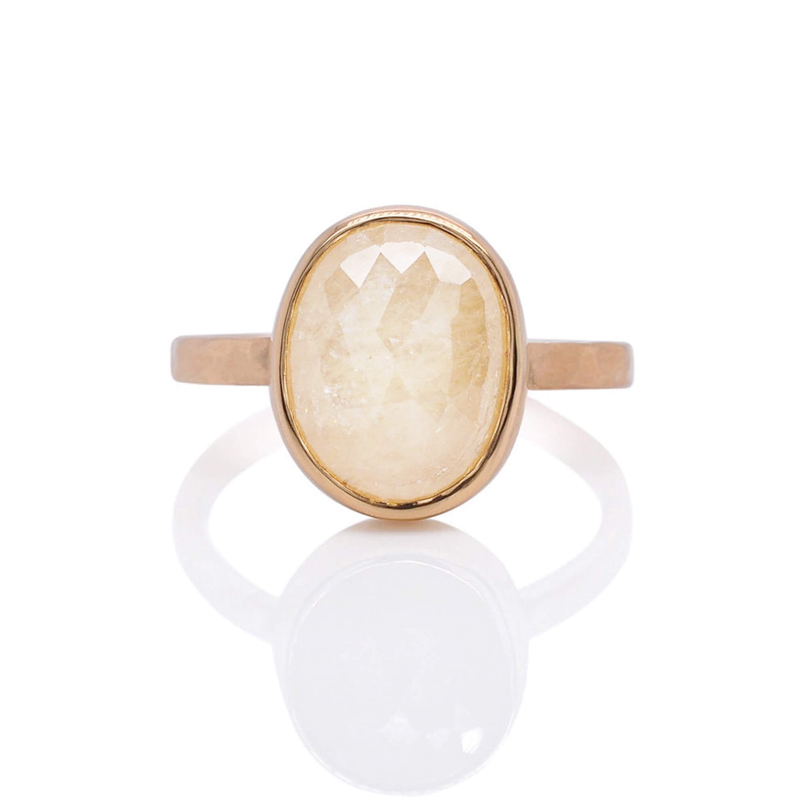 Cream colored sapphire in yellow gold. Handmade by EC Design Jewelry in Minneapolis, MN.