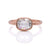 Cushion cut Moissanite engagement ring in satin finished rose gold.
