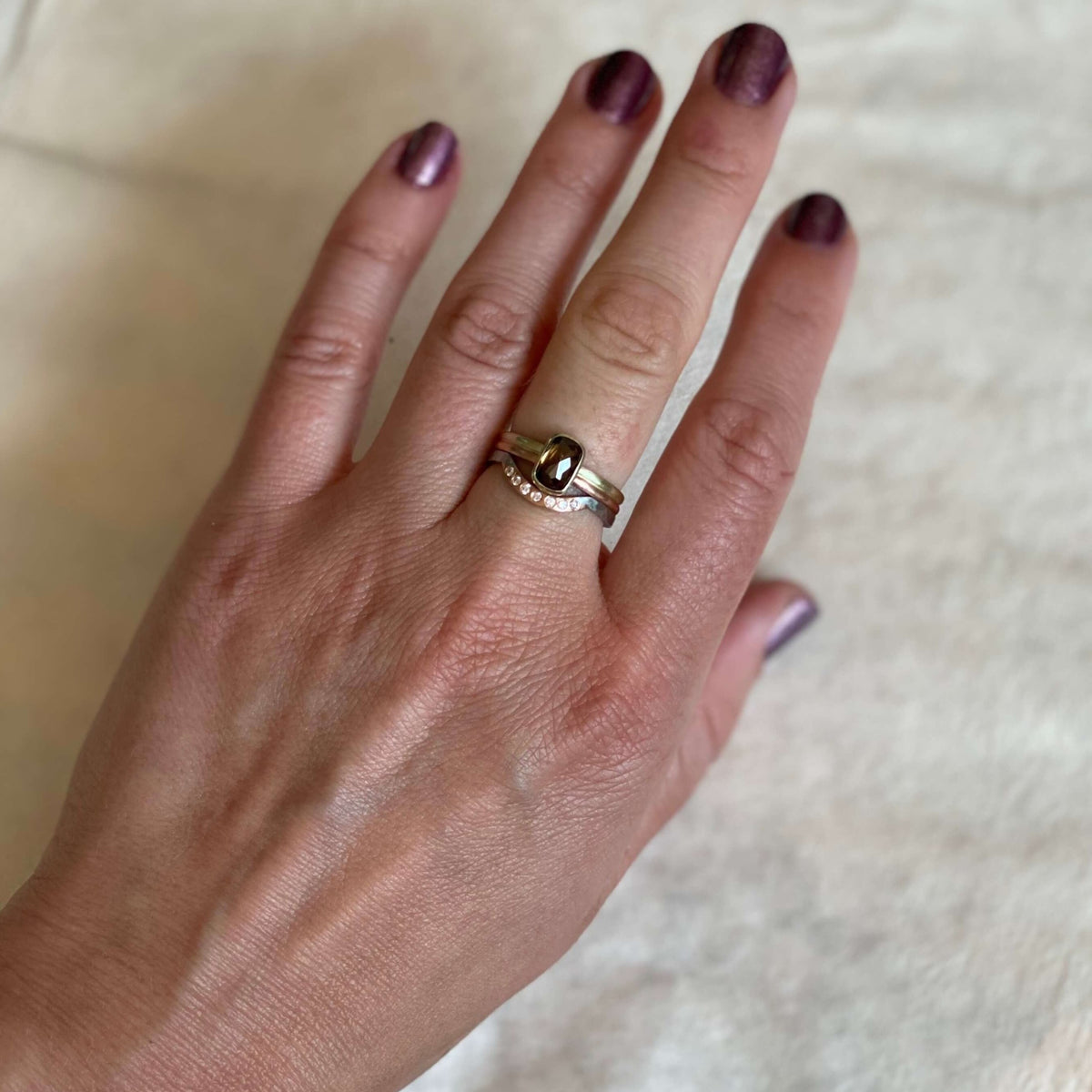 Mixed metal stack with cognac diamond solitaire and diamond accented contour band. Each ring is handmade using recycled metal and conflict-free stones. EC Design Jewelry, Minneapolis, MN.