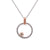 Palladium and rose gold circle pendant with champagne diamond accent. Handmade by EC Design Jewelry in Minneapolis, MN using recycled metal and conflict-free stone.