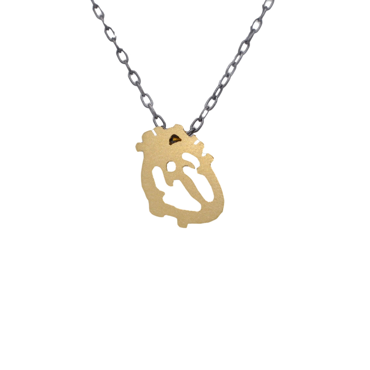 Yellow gold anatomical heart on an oxidized chain. Handmade by EC Design in Minneapolis, MN using recycled metal.