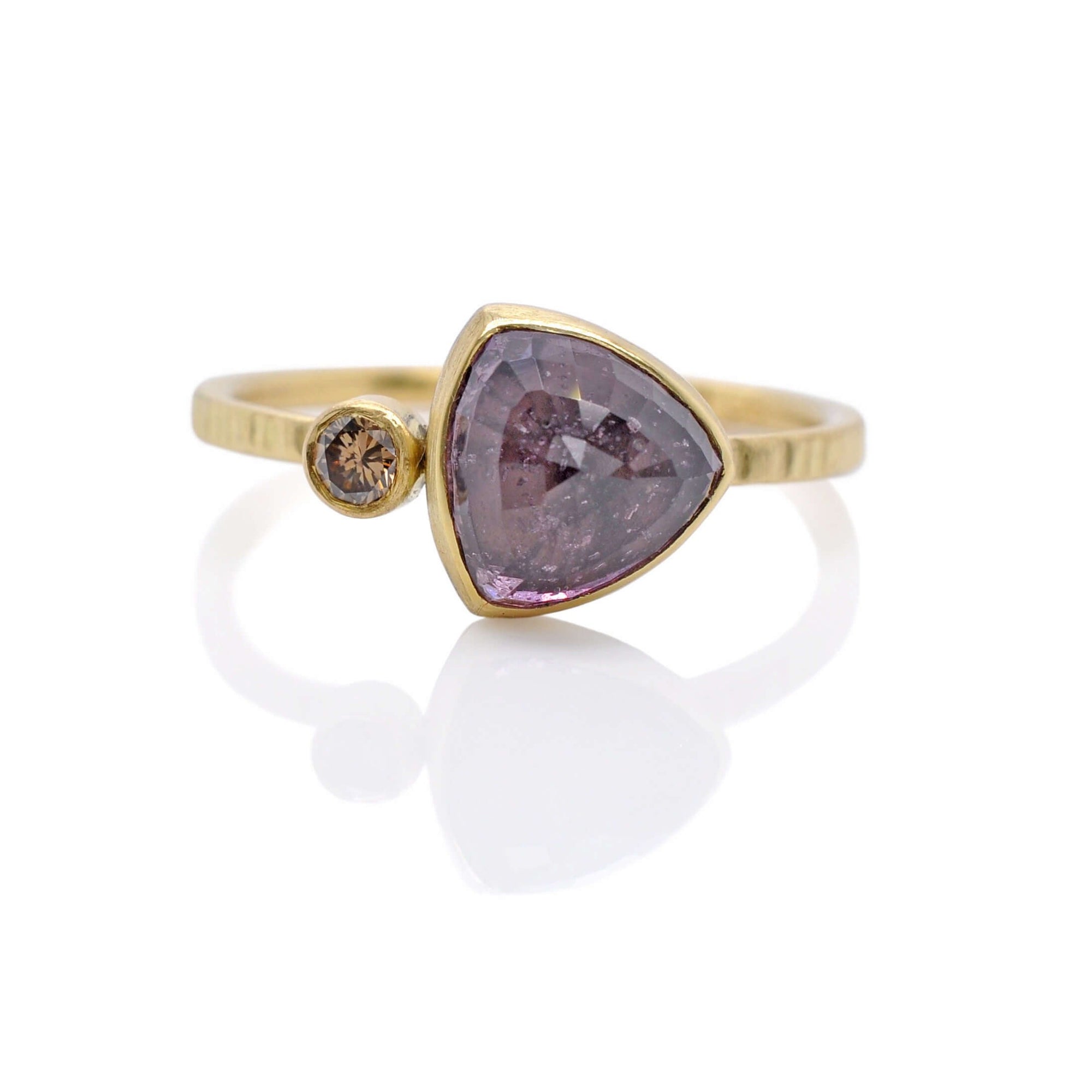 Trillion cut purple sapphire and champagne diamond duo ring in yellow gold. Handmade by EC Design Jewelry in Minneapolis, MN.