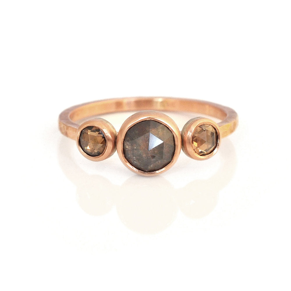 Three stone diamond ring in rose gold. Handmade by EC Design Jewelry in Minneapolis, MN.