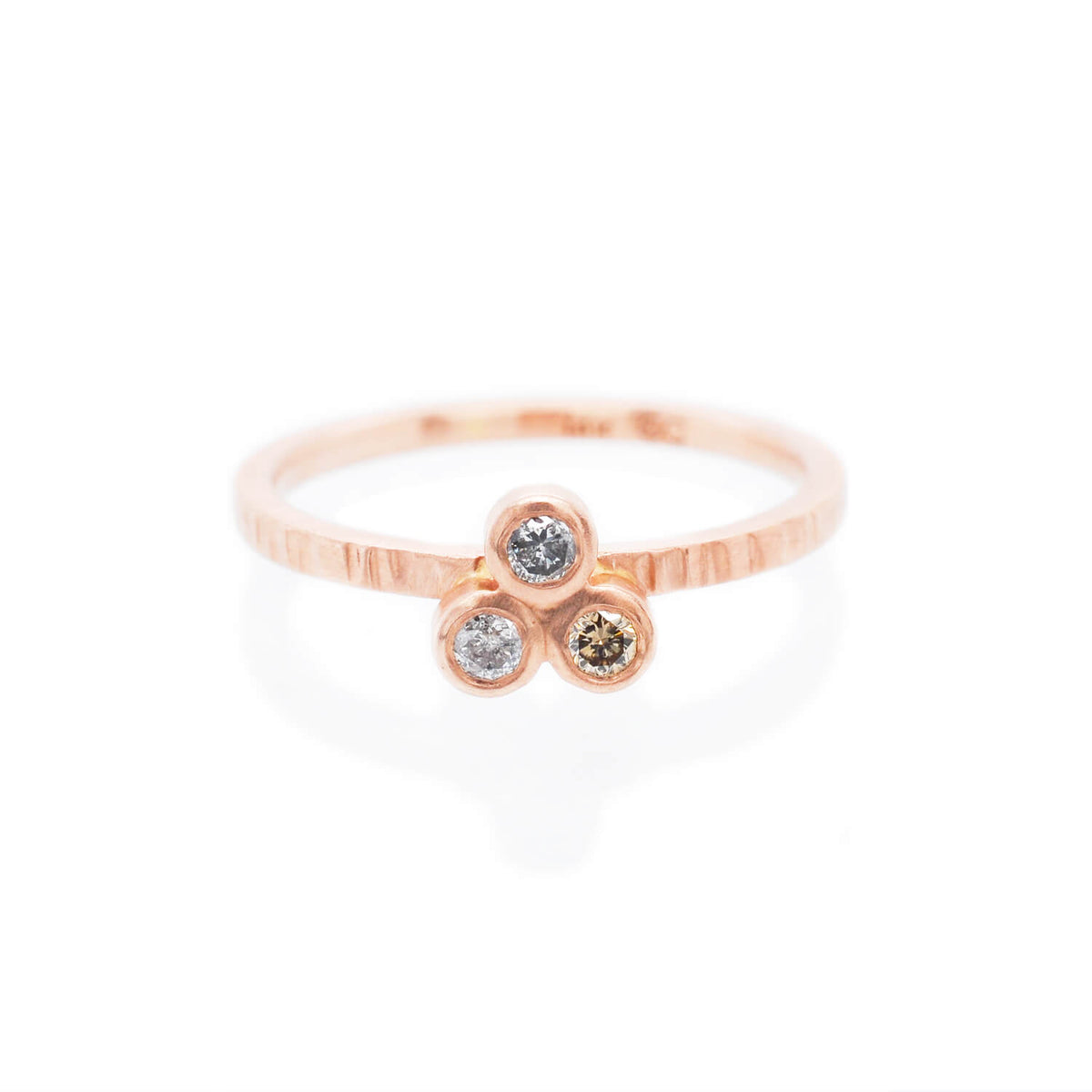3-stone red gold ring with salt and pepper and champagne diamonds. Ethically crafted by EC Design Jewelry in Minneapolis, MN.