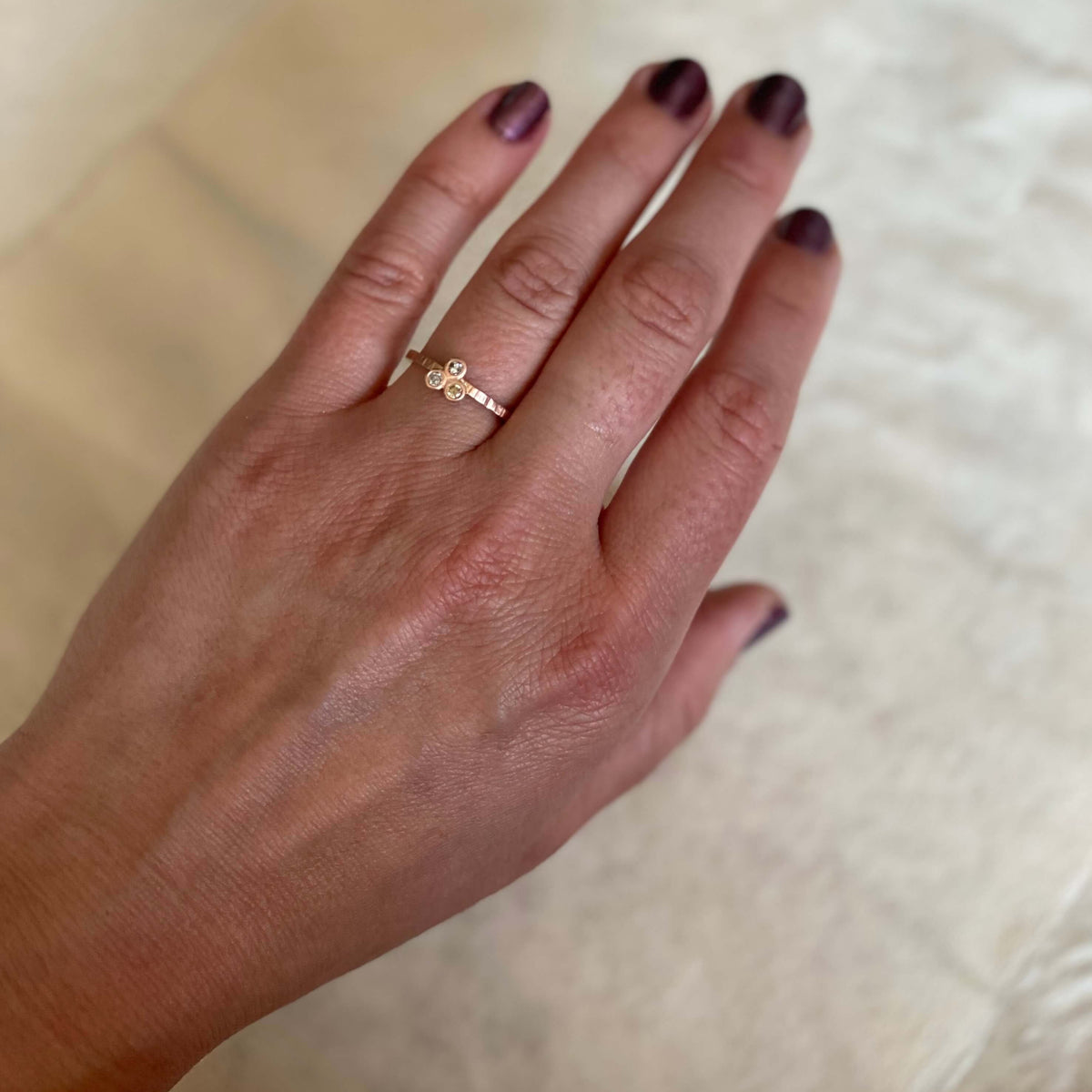 Fun diamond ring in red gold with 3 brilliant cut stones. Handmade by EC Design in Minneapolis, MN using recycled metal and conflict-free stones.