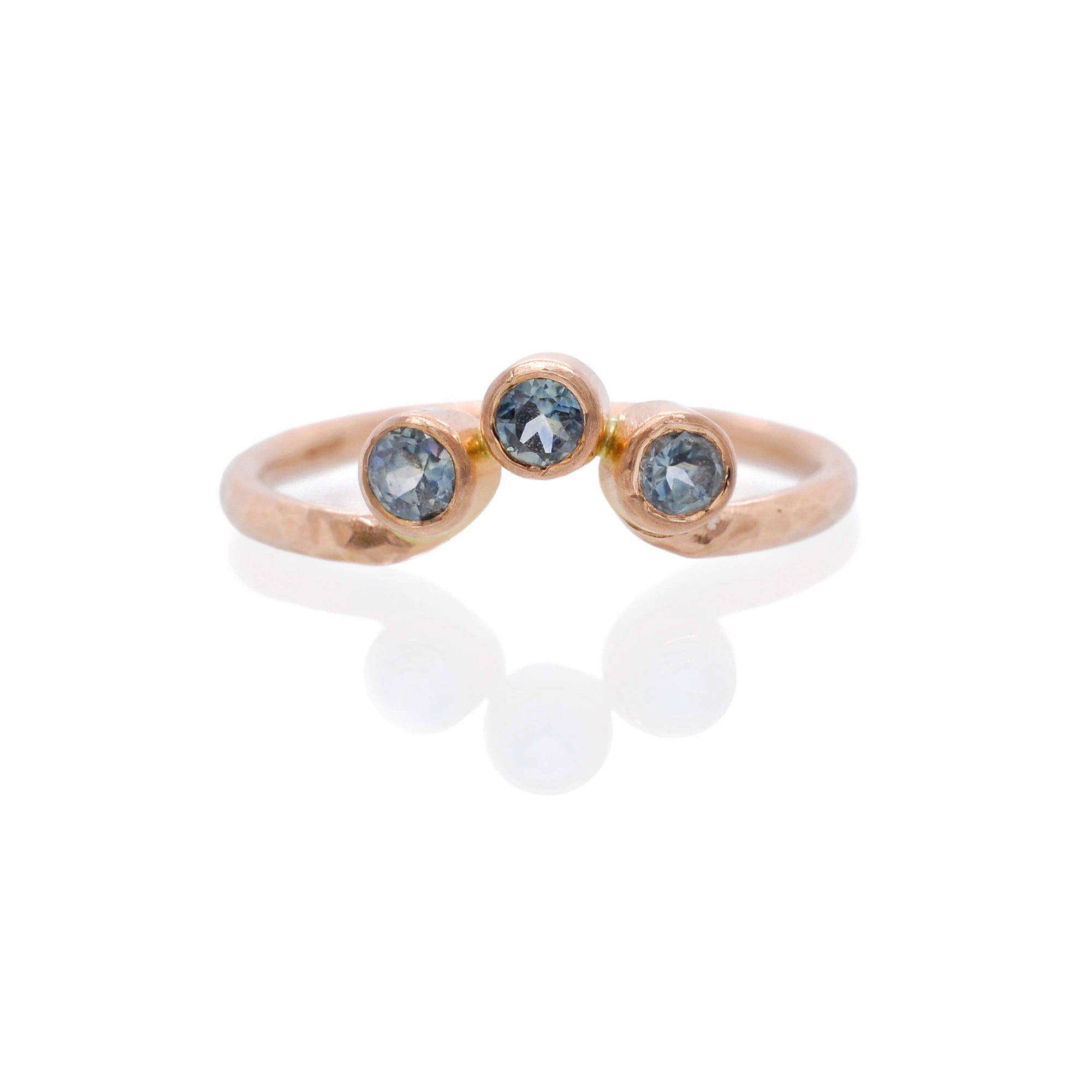 Blue sapphire and rose gold contour band from EC Design Jewelry in Minneapolis, MN. Made with recycled metal and conflict-free stones.