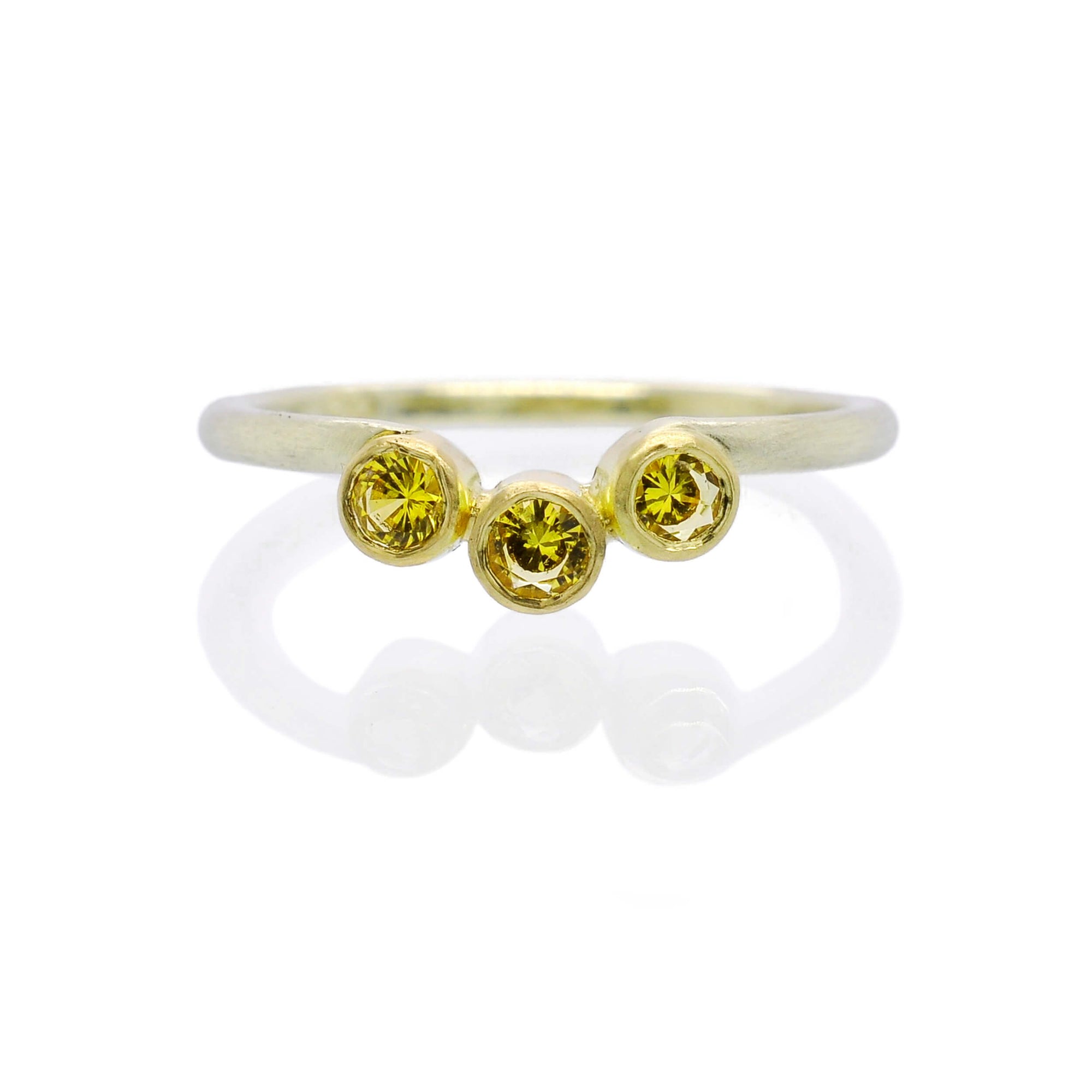 Round brilliant yellow sapphire contour band in yellow and green gold. Handmade by EC Design Jewelry in Minneapolis, MN using recycled metal and conflict-free stones.