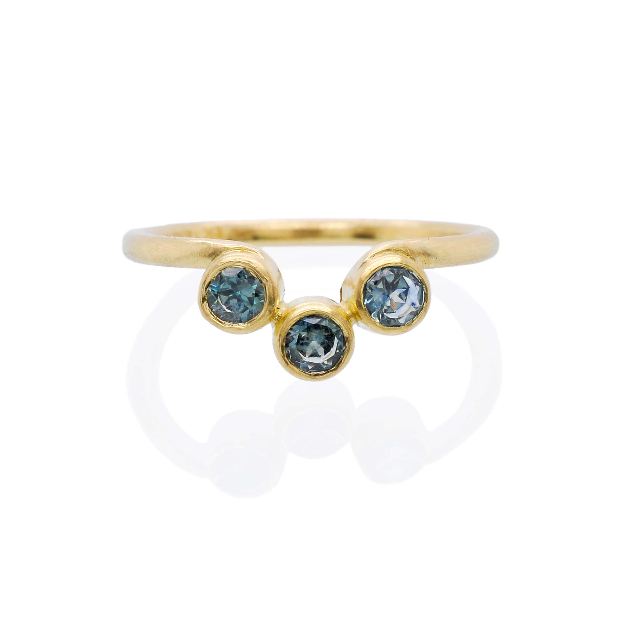 Yellow gold and blue Montana sapphire contour wedding band. Handmade by EC Design Jewelry in Minneapolis, MN using recycled metal and conflict-free stones from Montana.