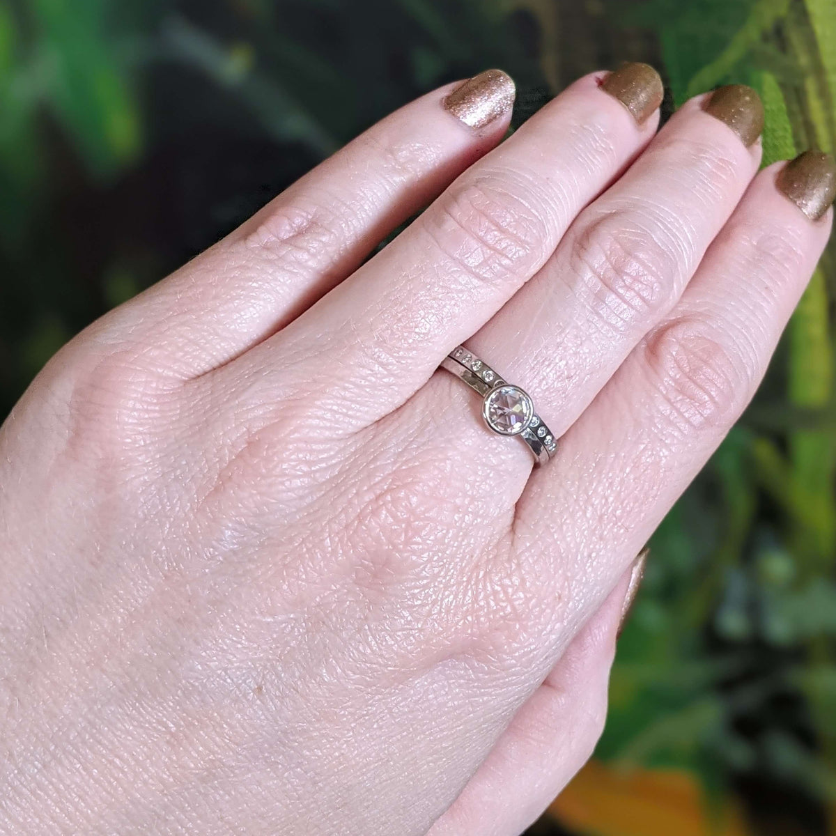Moissanite engagement ring in palladium white gold with a diamond eternity band in palladium. Handmade by EC Design Jewelry in Minneapolis, MN.