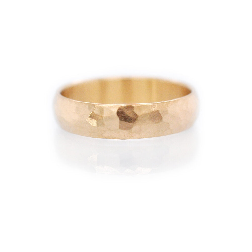 Handmade 14k yellow gold hammered band. Made by EC Design Studio in Minneapolis, MN using recycled metal.