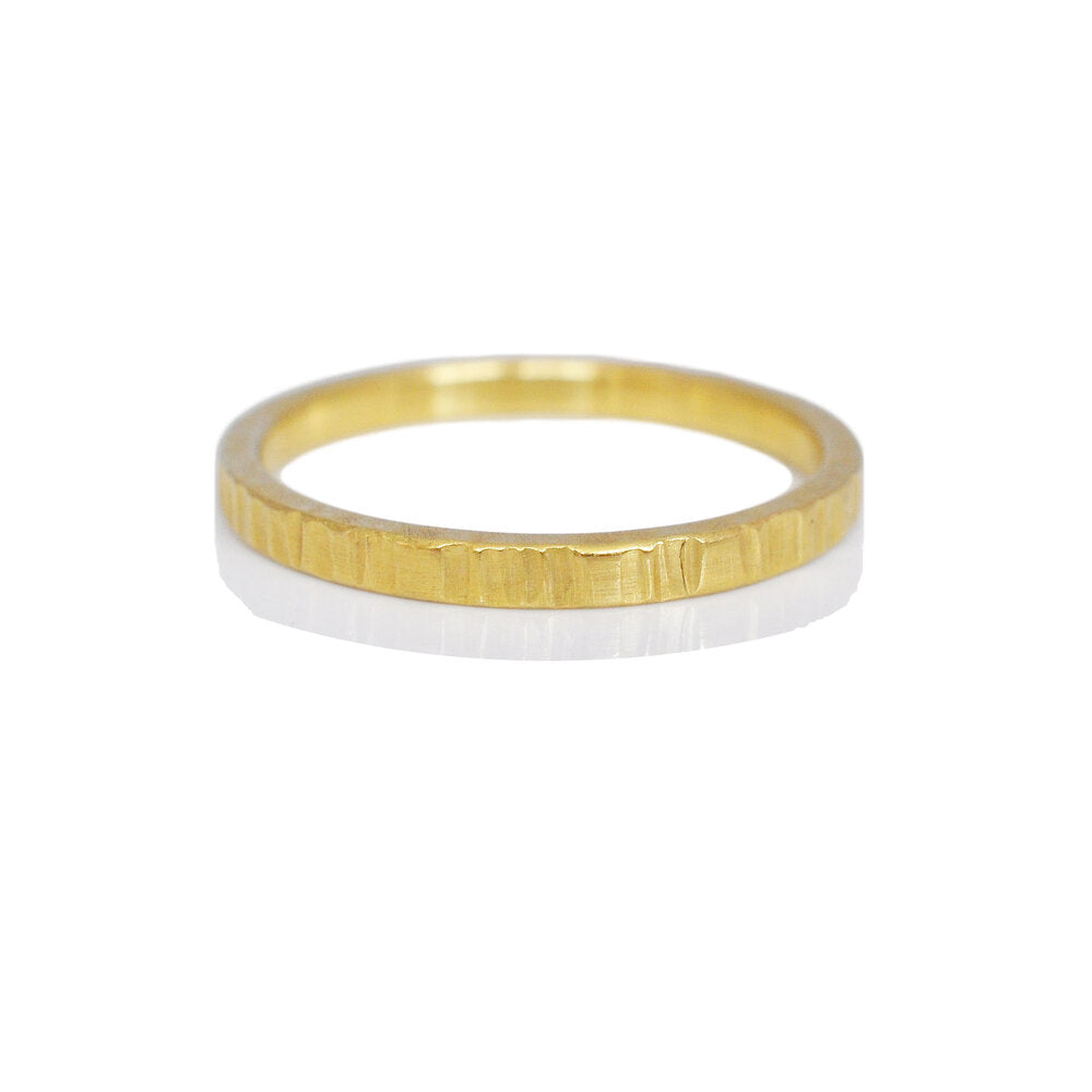 Linear hammered band of 18k yellow gold. Handmade by EC Design Jewelry in Minneapolis, MN.