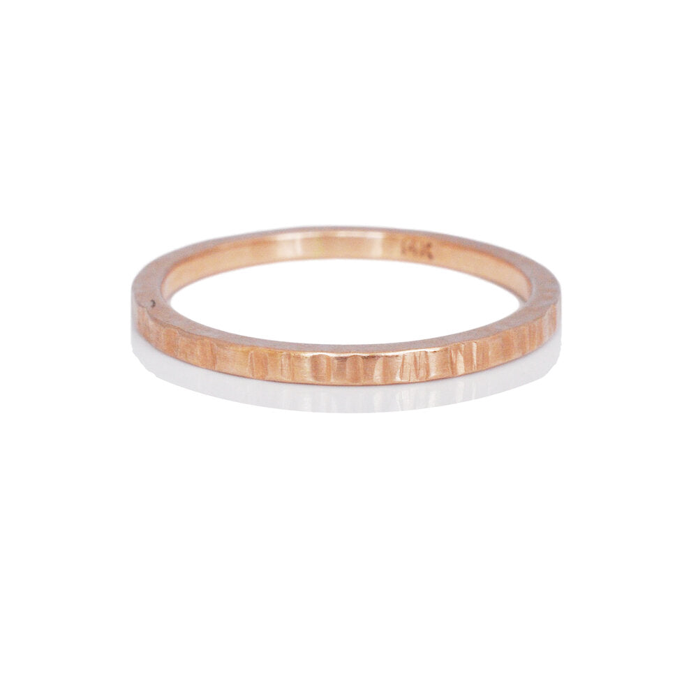 Handmade red gold wedding band with a linear hammered finish. Made in Minneapolis, MN by EC Design Studio.