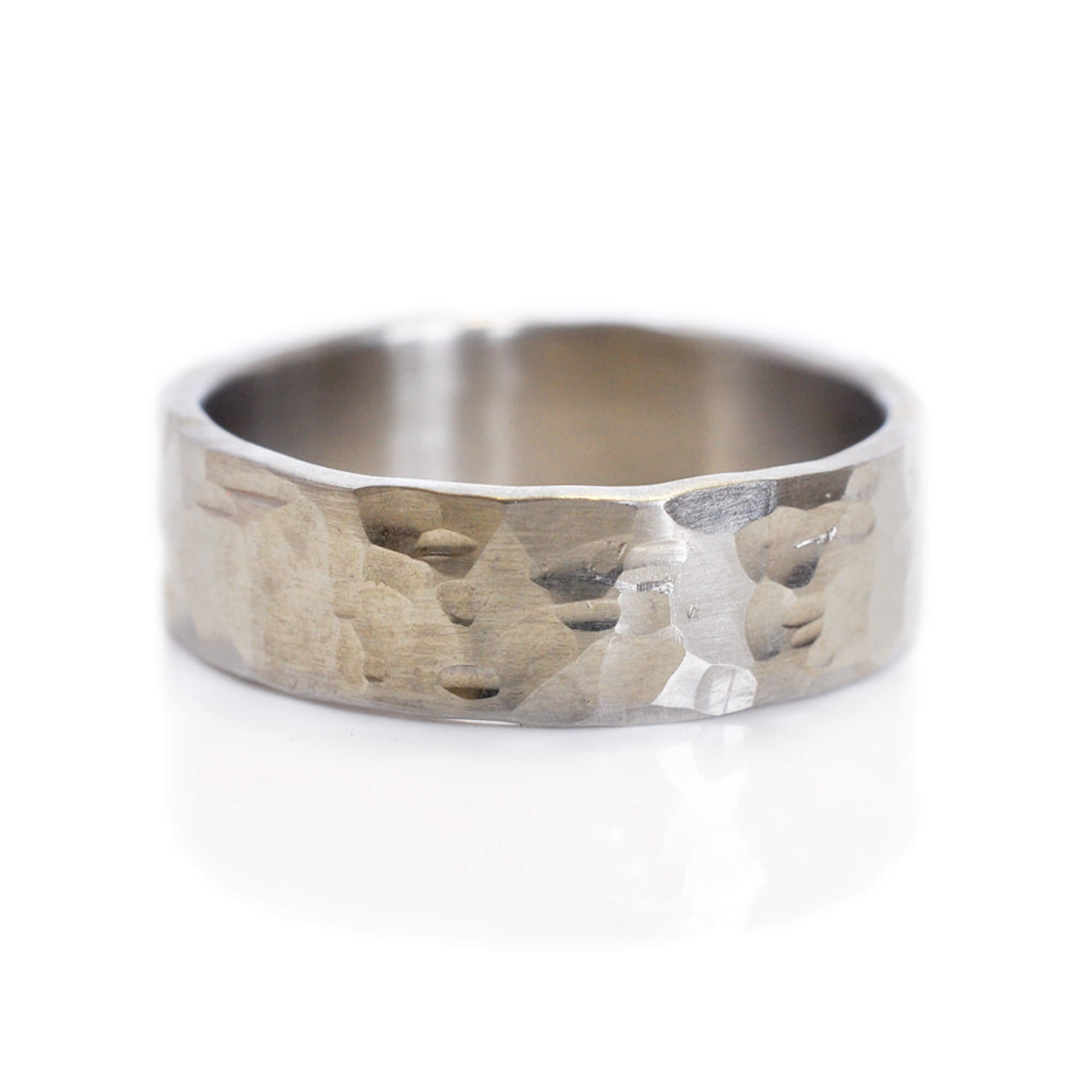 Random hammered wide wedding band in palladium. Handmade by EC Design Jewelry in Minneapolis, MN using recycled metal.