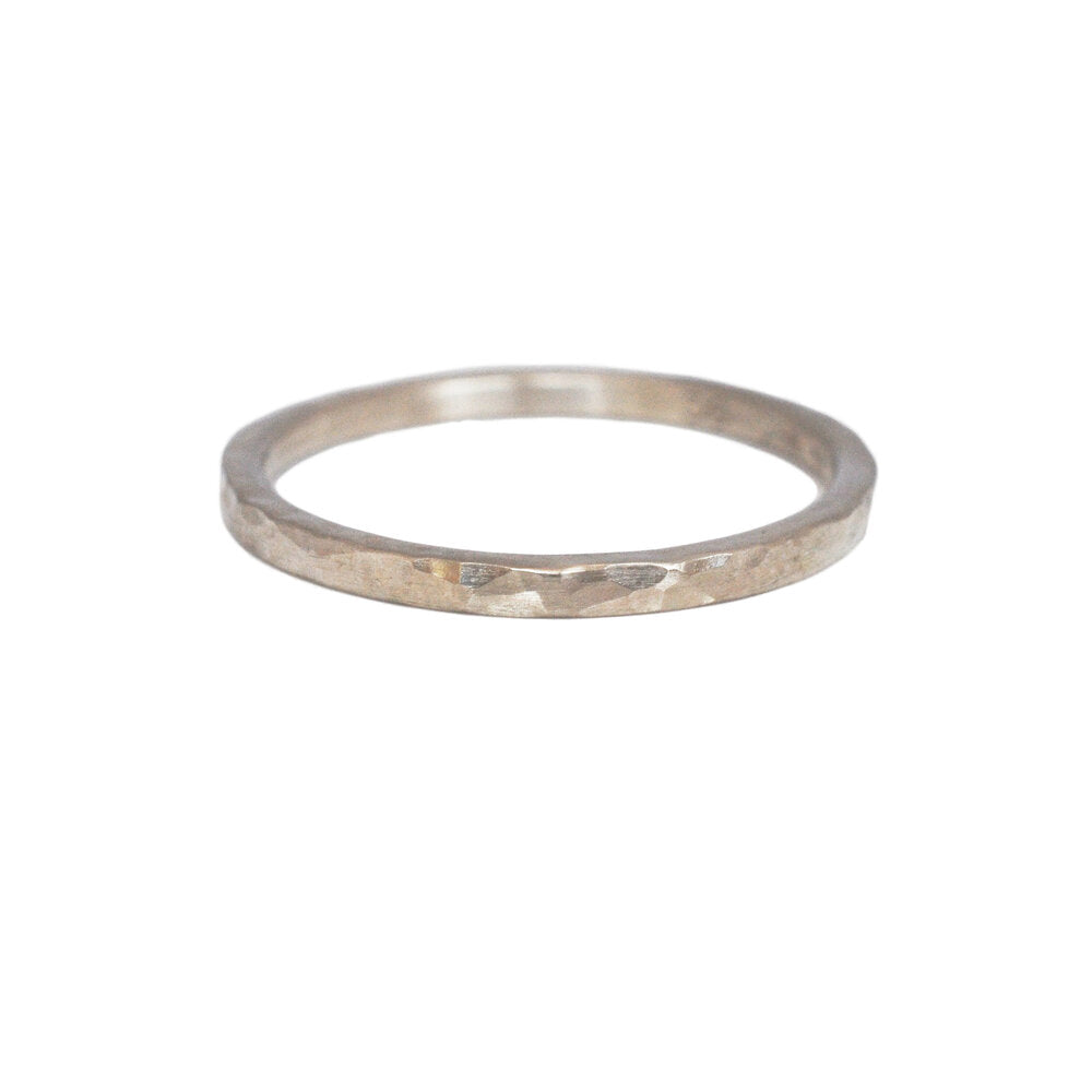 Simple and modern hammered wedding band in palladium white gold. Handmade with recycled metal  by EC Design Studio in Minneapolis, MN.