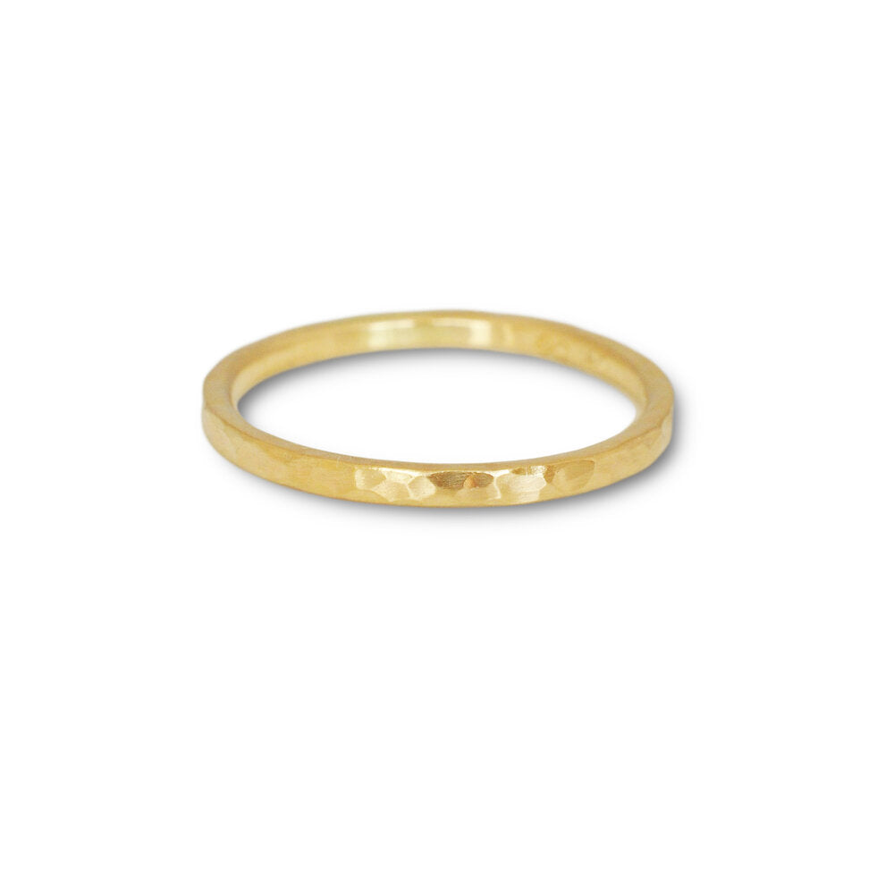 Hammered yellow gold wedding band. Handmade by EC Design Studio in Minneapolis, MN using recycled metal.