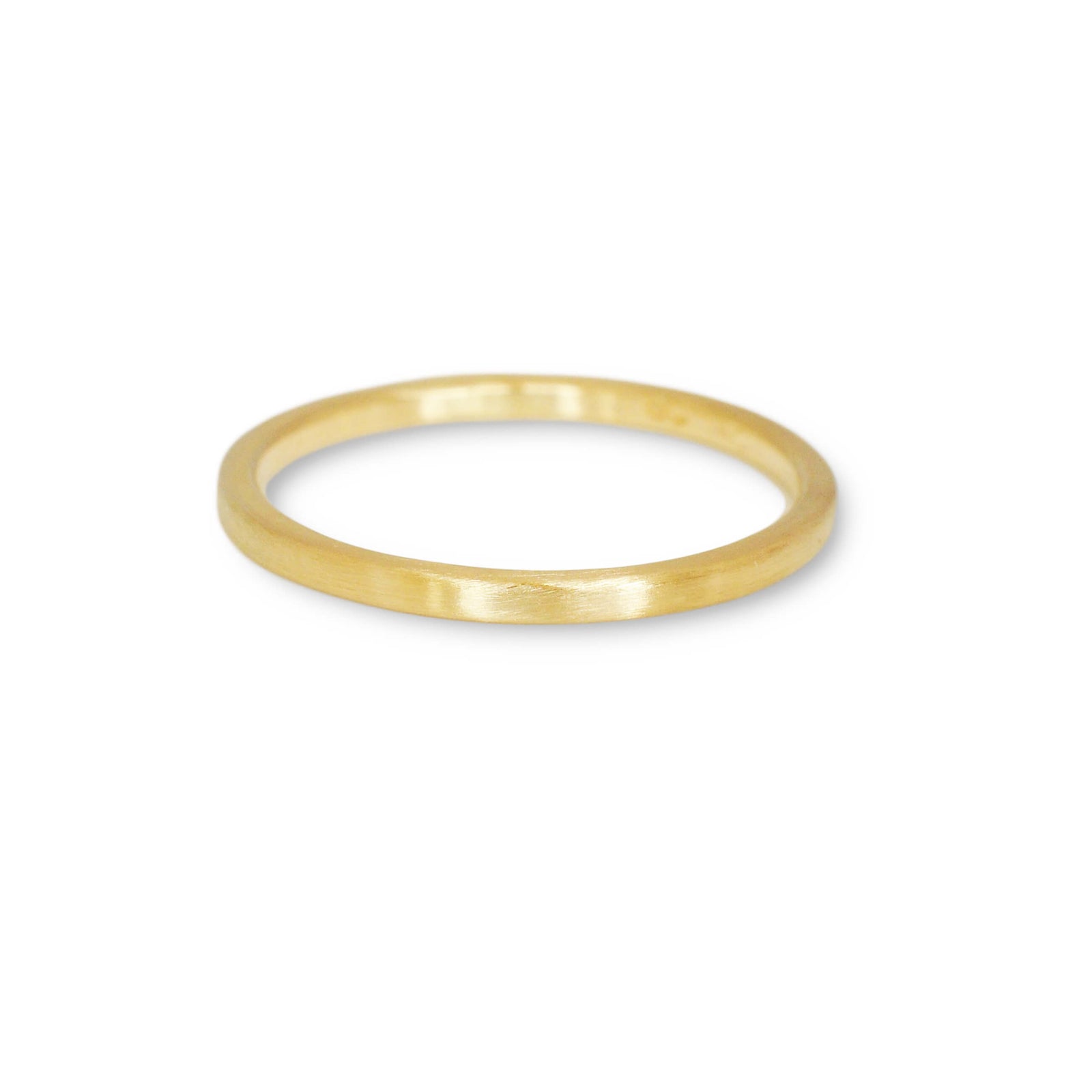 Warm yellow gold simple wedding band. Handmade by EC Design Jewelry in Minneapolis, MN using recycled metal.