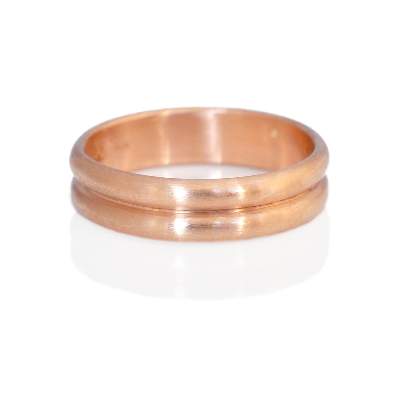 Double low dome wedding band in 14k red gold. Handmade by EC Design Jewelry in Minneapolis, MN using recycled metal.