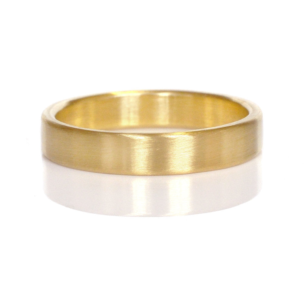 Satin finished yellow gold wedding band. Handmade by EC Design Jewelry using recycled metal.