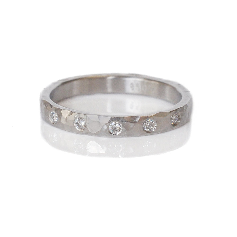Hammered palladium half eternity band with Canadian mined white diamonds. Handmade by EC Design in Minneapolis, MN using recycled metal and conflict-free stones.