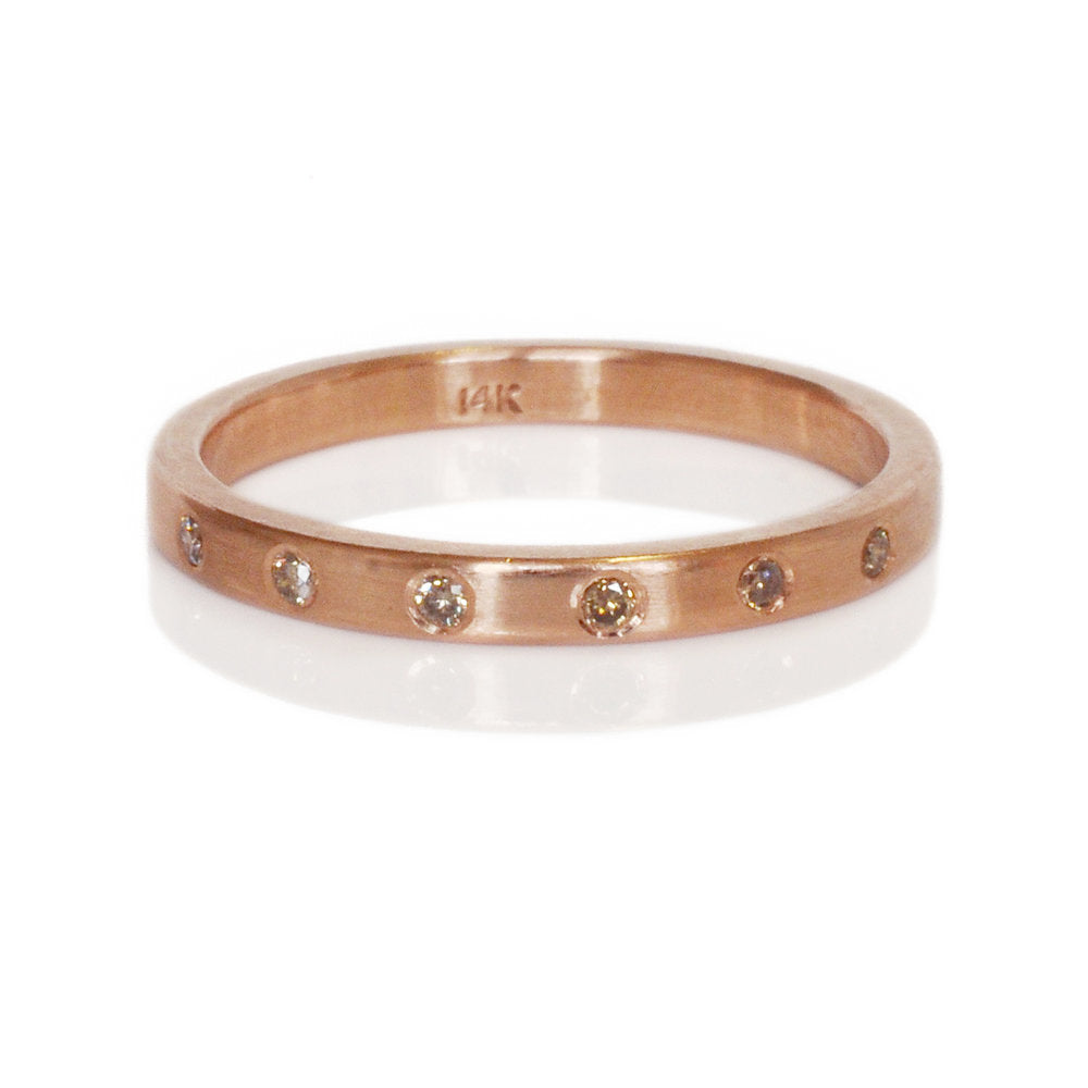 Rose gold and champagne diamond eternity band. Handmade by EC Design Jewelry in Minneapolis, MN using recycled metal and conflict-free stones.