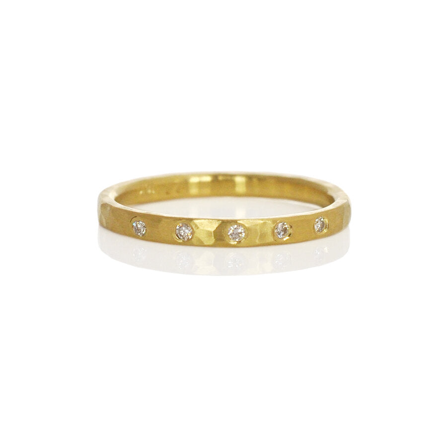 18k yellow gold hammered wedding band with 5 Canadian mined white diamonds. Handmade by EC Design Studio in Minneapolis, MN using recycled metal and conflict-free stones.