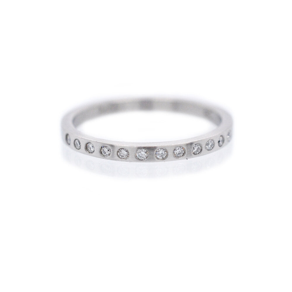 Close set half-eternity band in 950 palladium with Canadian mined white diamonds. Ethically crafted by EC Design Studio in Minneapolis, MN.
