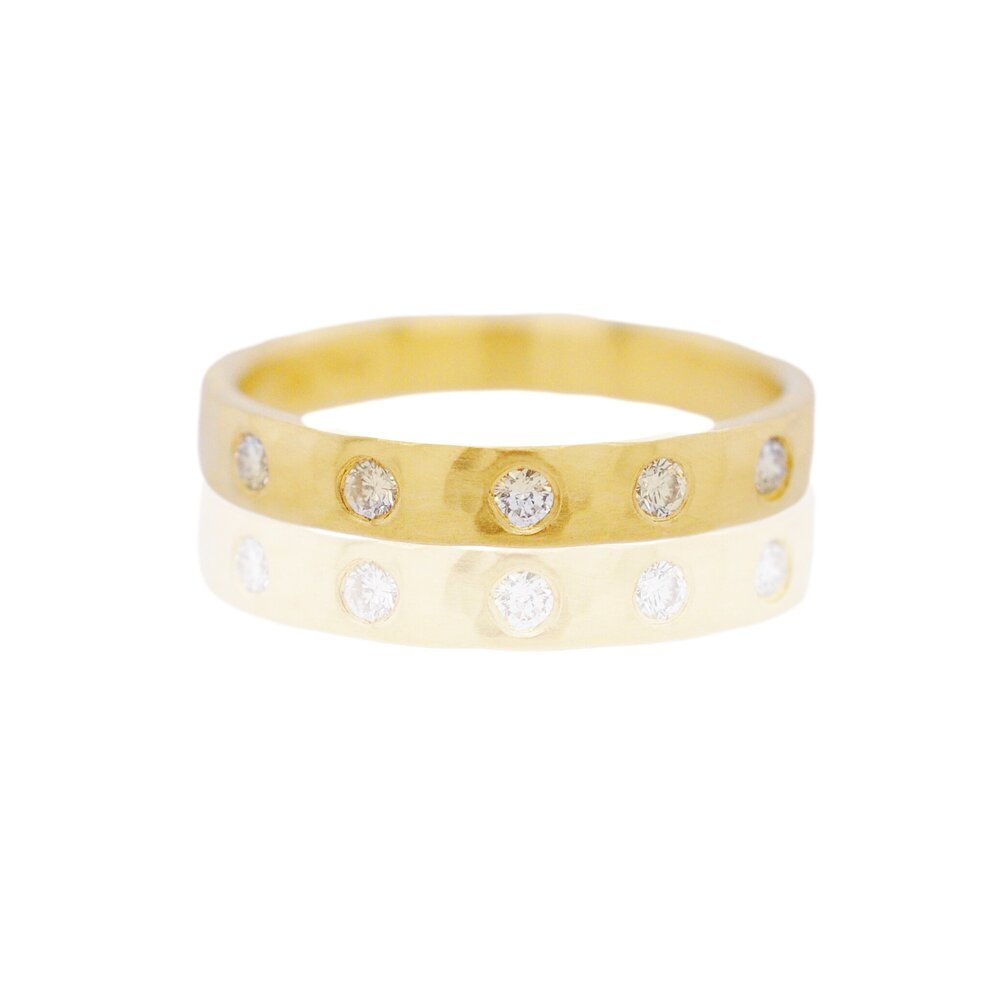 Handmade hammered 18k yellow gold eternity band with Canadian mined white diamonds. Made by EC Design Studio in Minneapolis, MN using recycled metal and conflict-free stones.