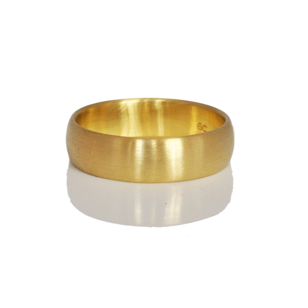 Yellow gold low dome wedding band. Handmade by EC Design Jewelry in Minneapolis, MN using recycled metal.