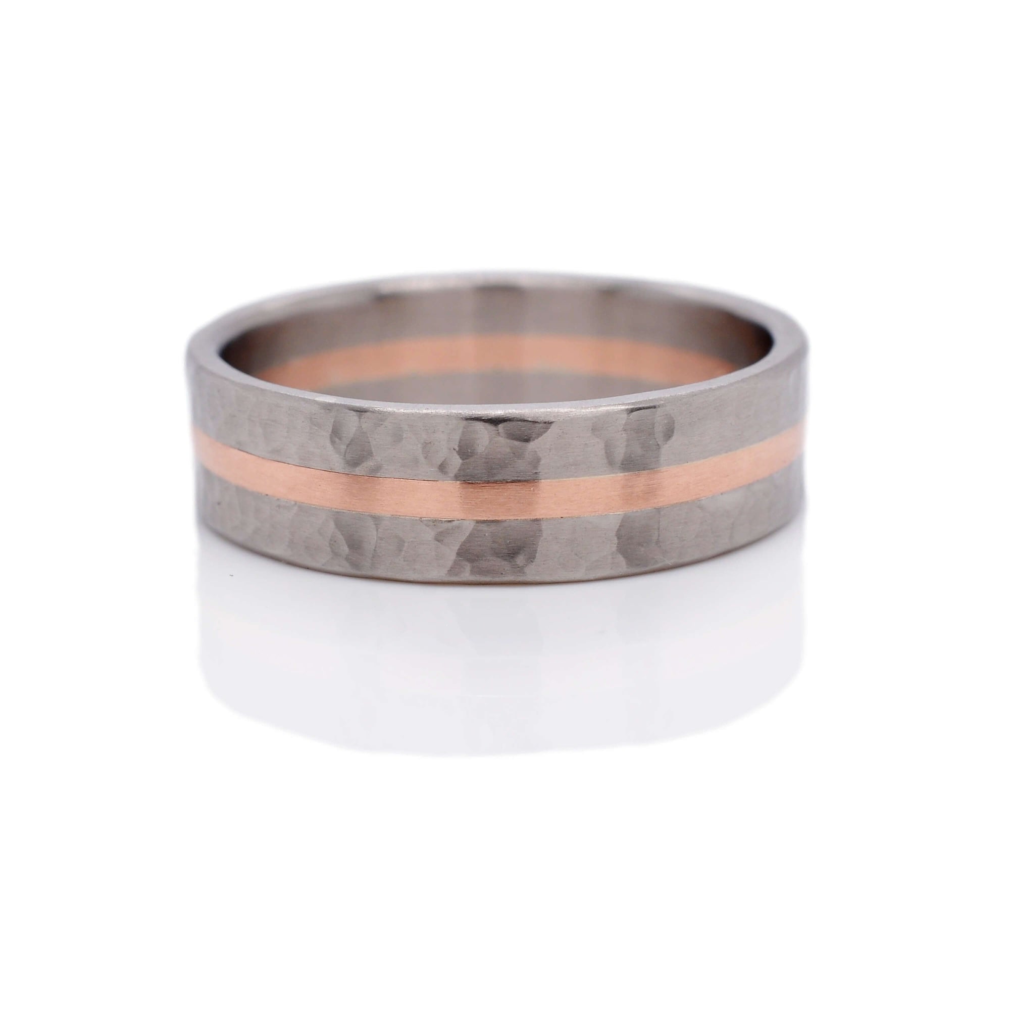 Hand hammered palladium and rose gold wedding band made by EC Design Jewelry in Minneapolis, MN.