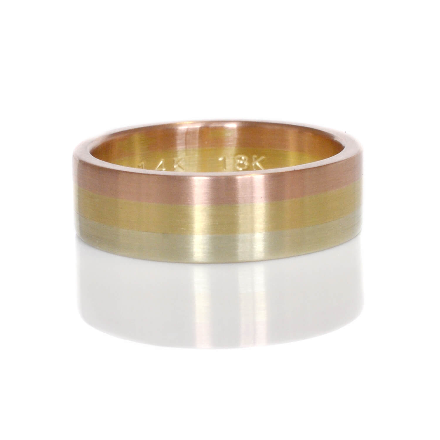 Handmade rainbow ring in mixed golds. Made by EC Design Studio using recycled red gold, yellow gold, and green gold.
