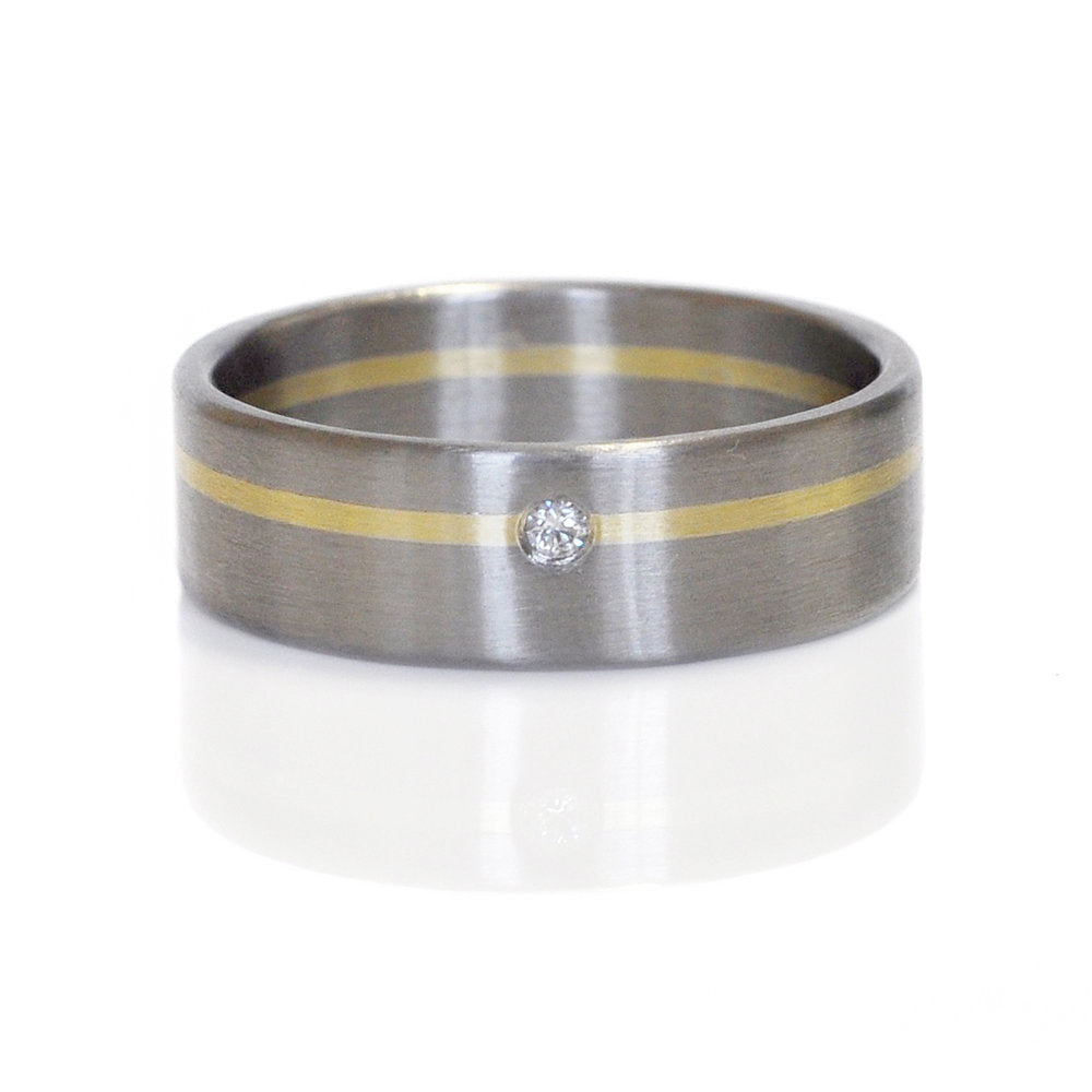 Palladium and yellow gold satin band with white diamond accent. Handmade by EC Design Jewelry in Minneapolis, MN using recycled metal and conflict-free stone.