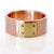 Red gold and yellow gold wide band with champagne diamond accents. Handmade by EC Design Jewelry in Minneapolis, MN using recycled metal.