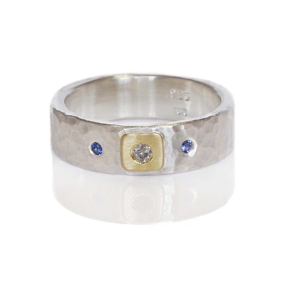 Hammered silver band with yellow gold, diamond, and sapphire accents. Handmade by EC Design using recycled metal and conflict-free stones.