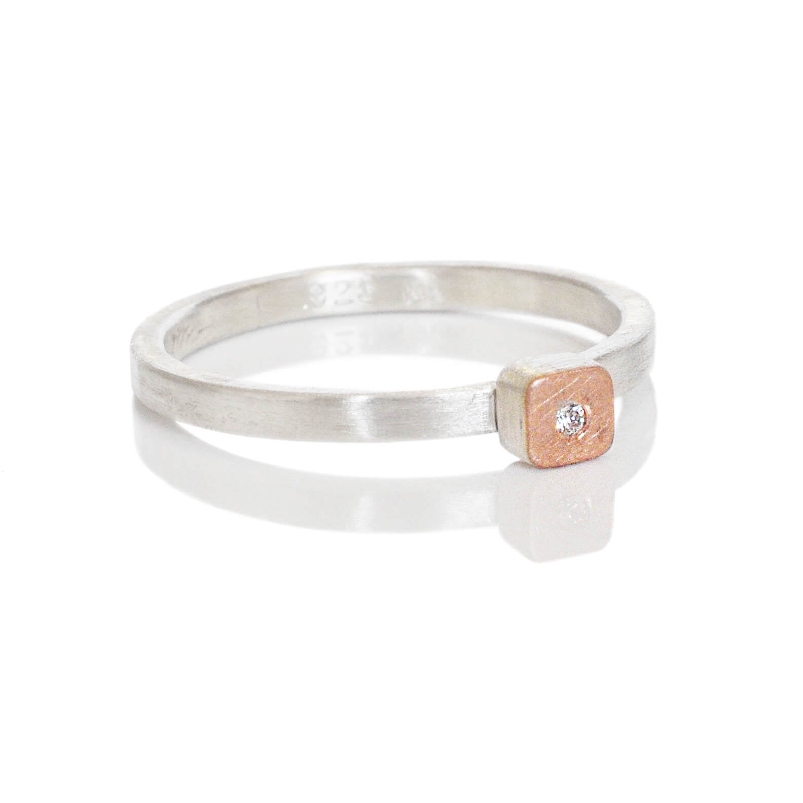 Sterling silver ring with square cell of red gold and a flush set diamond. Handmade by EC Design Jewelry in Minneapolis, MN using recycled metal and conflict-free stone.