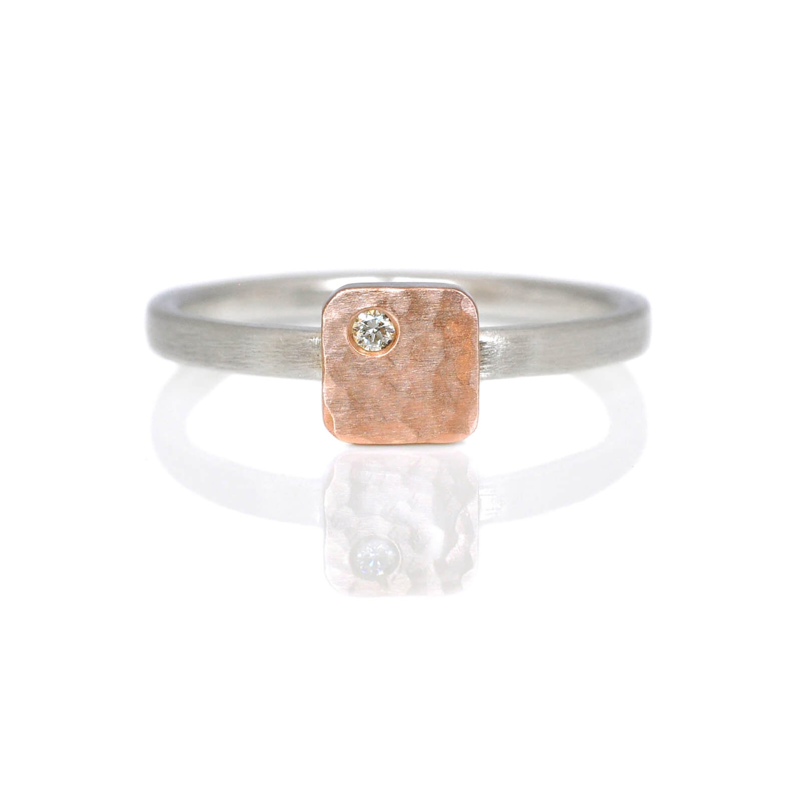 Sterling silver band with square cell of hammered red gold and a flush set diamond. Handmade by EC Design in Minneapolis, MN using recycled metal and conflict-free stone.